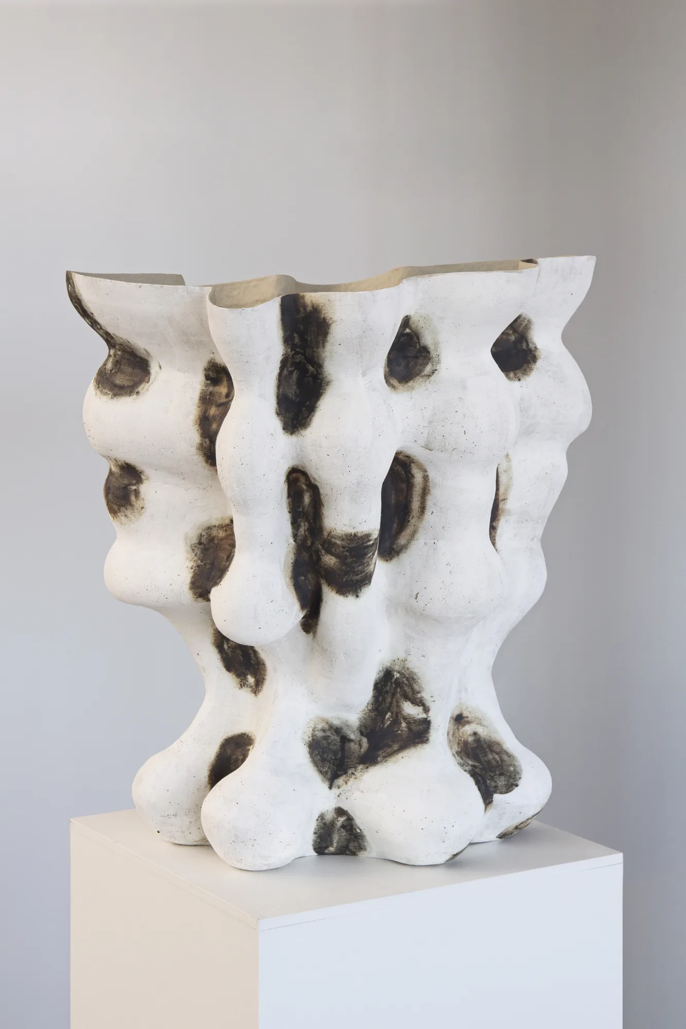 Tall hand-built ceramic vessel